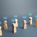 wooden avatars with comment boxes over their heads