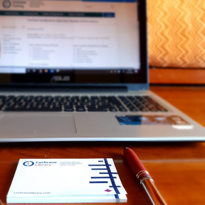 picture of a computer, pen, and note pad with Cochrane logo