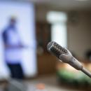 Image of a microphone in a conference room