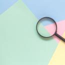magnifying glass on a colorful background