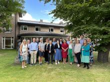 Photo of the Governing Board outside the meeting's venue