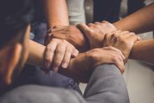 Teamwork! Hands joined together