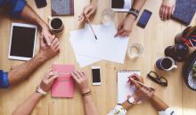 Picture of team brainstorming, high angle view of the table