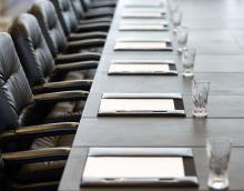 Boardroom table set for a meeting Table set for a meeting