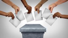 A picture of a ballot box and different people casting their votes