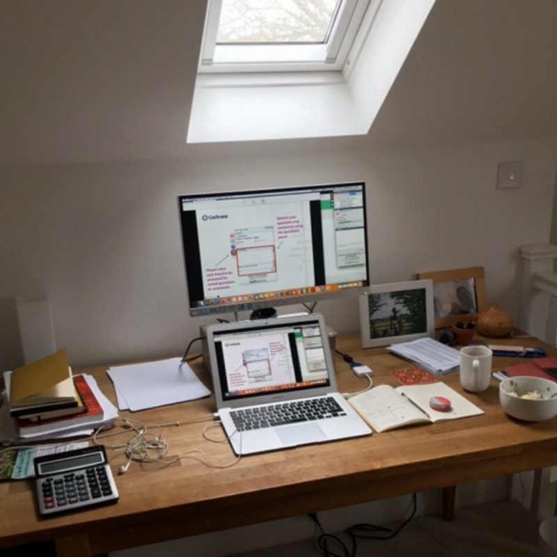 Picture of a desk with a skylight right above it